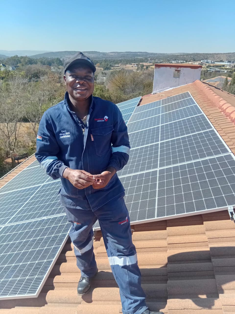 Gary, lead electrician, on a rooftop solar installation